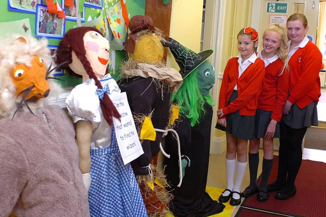 Children from Sacred Heart created a scarecrow trail around the school in 2013. Pictured, from left, are: Katie Fraser, Rosanna Rigali and Kimberley Wray.