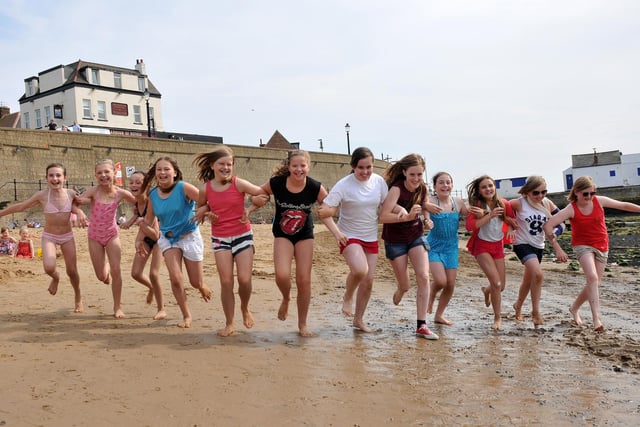 Friends have fun on the beach at Fish Sands in 2012.