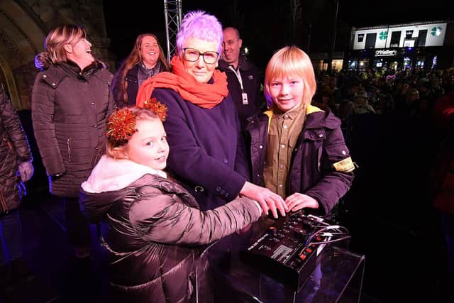 Dot Wright, 72, with her grand children Fearne Wright, 8, and Evan Wright, 10, switching on the Hartlepool Christmas Lights in Church Square. Picture by FRANK REID