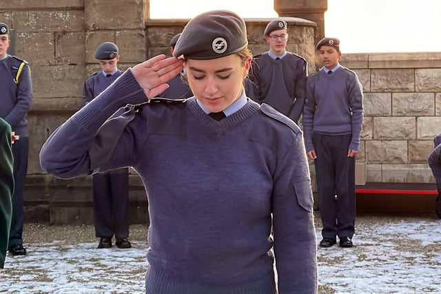 An air cadet salutes.