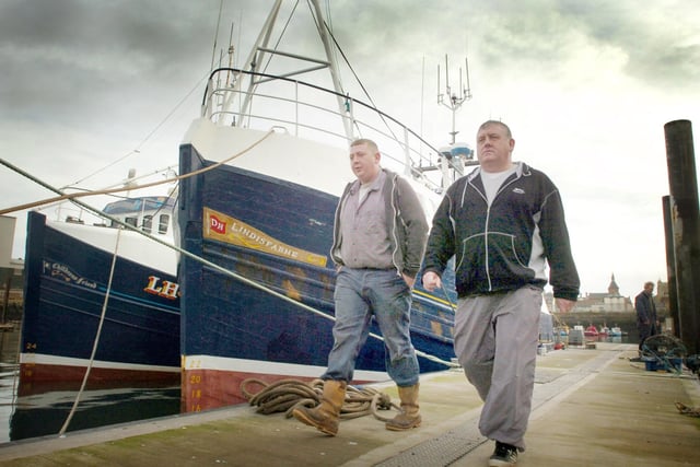 Fishing boat skippers Paul Graves (left) and Major Hartley take a stroll along the quay in 2008.