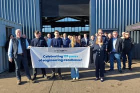 Members of the Pailor family (front) celebrate JJ Hardy & Son's 170th anniversary with staff, customers, suppliers and MP Jonathan Brash.