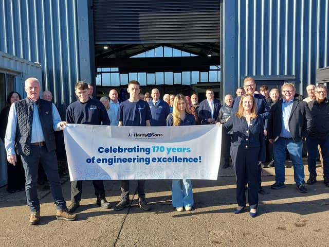 Members of the Pailor family (front) celebrate JJ Hardy & Son's 170th anniversary with staff, customers, suppliers and MP Jonathan Brash.