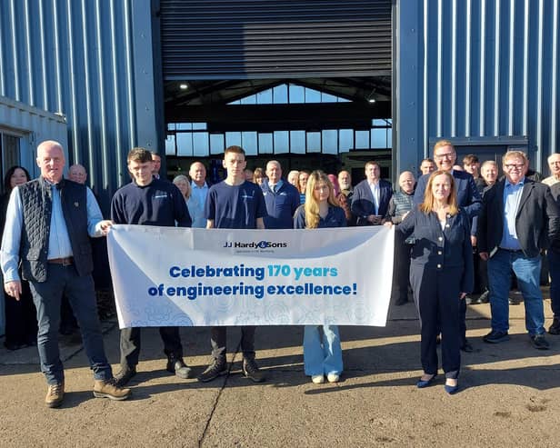Members of the Pailor family (front) celebrate JJ Hardy & Son's 170th anniversary with staff, customers, suppliers and MP Jonathan Brash.