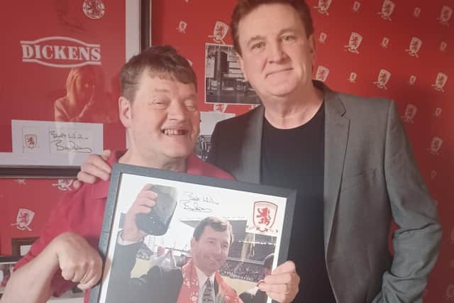 Eric Hughes (left) and Paul 'Goffy' Gough with the signed picture of Brian Robson.