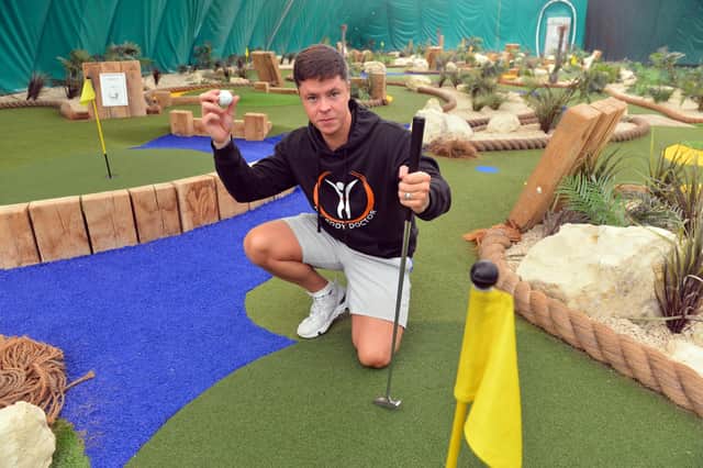 Steven Smith on the mini golf course at the golf dome.