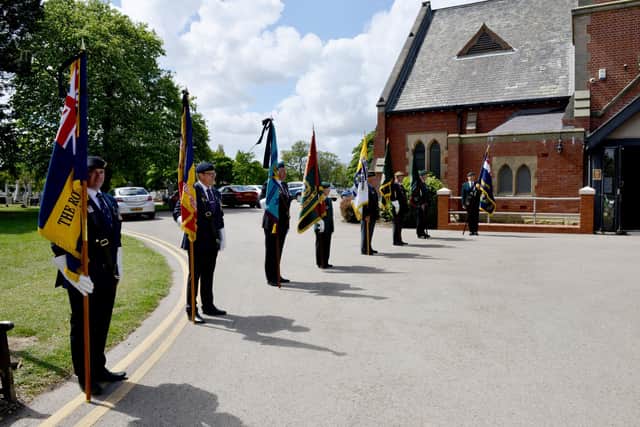 Standard bearers with their standards at the funeral service for Charles Humphrey. By FRANK REID