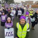 David Newey, UNISON area organiser (front right) and Yvonne Tait, senior healthcare assistant at the University Hospital of Hartlepool (front left) stand outside the University Hospital of Hartlepool alongside their fellow colleagues who are also striking in dispute of pay.