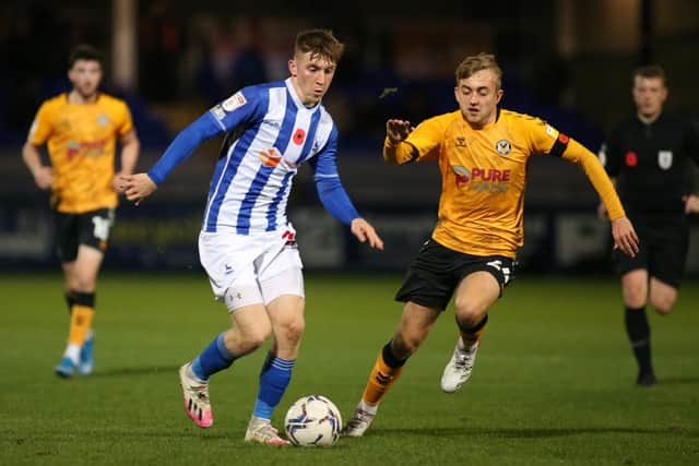 Hartlepool United's Matty Daly goes past Newport County's Jake Cain   during the Sky Bet League 2 match between Hartlepool United and Newport County at Victoria Park, Hartlepool on Friday 12th November 2021. (Credit: Michael Driver | MI News)