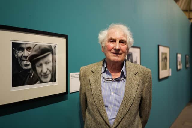 Photographer John Bulmer next to one of the photographs in his exhibition at Hartlepool Art Gallery.