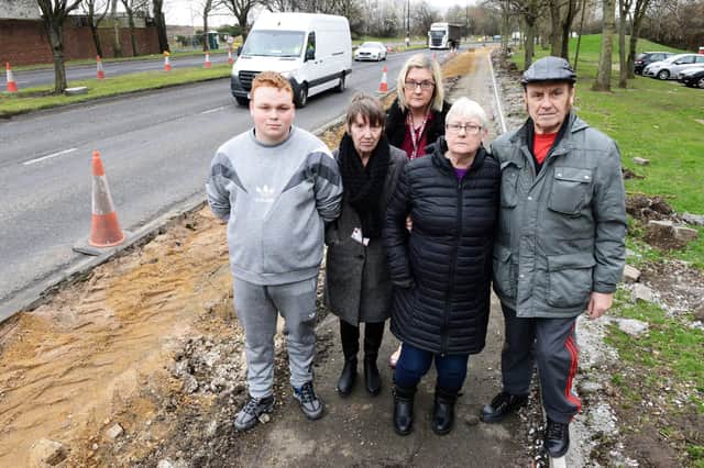 Concerned residents and Belle Vue Sports Community and Youth Centre users (left to right) Connor Stallard, Susan Rowley, Claire Wainwright, Joan Sowerby and Brian Maiden alongside the A689 at the rear of the centre. Picture by FRANK REID