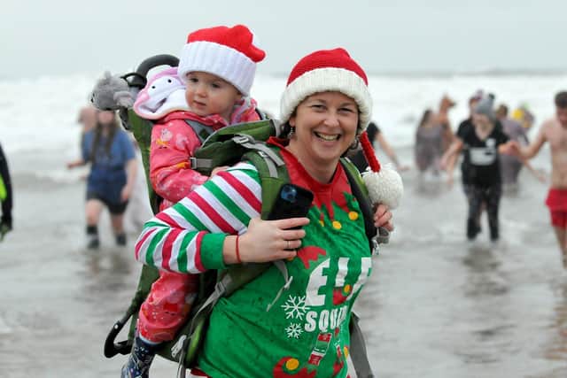 Mum Liz Metcalf with her daughter Harper taking part in the Hartlepool Round Table Boxing Day dip/Photo: Photo: Frank Reid