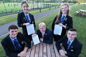 Mark Tilling, Headteacher of High Tunstall School and students (left to right) Tom Short, Cassie Gray, Amelia Connelly and Sam Miller with a copy of their Ofsted report. Picture by Frank Reid.
