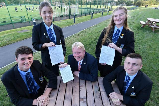 Mark Tilling, Headteacher of High Tunstall School and students (left to right) Tom Short, Cassie Gray, Amelia Connelly and Sam Miller with a copy of their Ofsted report. Picture by Frank Reid.