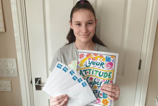 Dyke House Academy pupil Hannah Wilson with some of the letters she has written to residents of Charlotte Grange in Hartlepool.