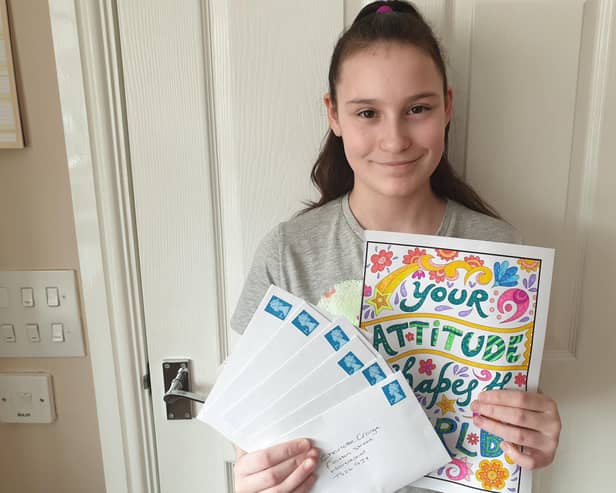 Dyke House Academy pupil Hannah Wilson with some of the letters she has written to residents of Charlotte Grange in Hartlepool.
