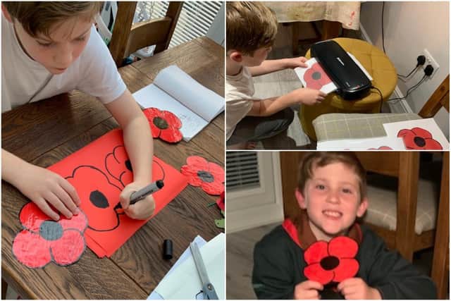 Eight-year-old Harry Fletcher making his poppies which he is selling for the Royal British Legion.