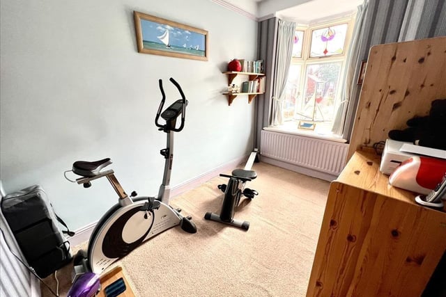 One of the bedrooms of the home has been transformed into a gym.