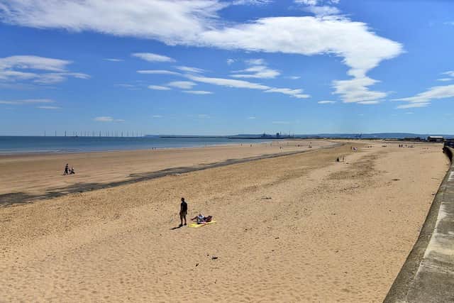 Two men have died at Seaton Carew after reportedly entering the water to rescue two children who were struggling in the water.