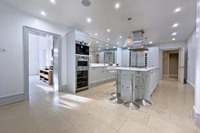 This gorgeous kitchen leads out into the pool area and garden.