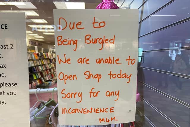 A sign in the shop window to explain why it was closed.