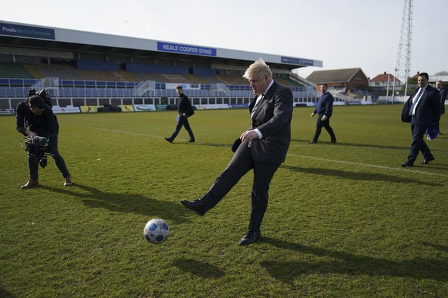 Britain's Prime Minister Boris Johnson kicks a soccer ball during a visit to Hartlepool United Football Club last year. Photo: Ian Forsyth/Pool via AP.