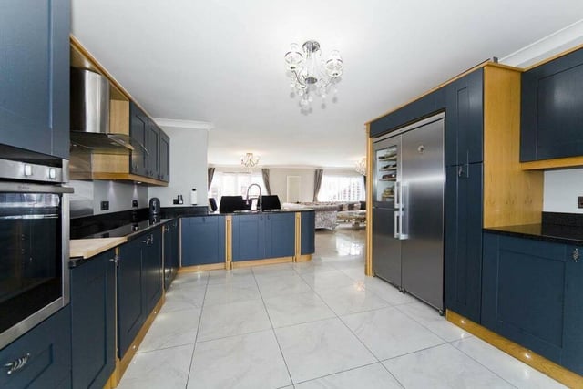 Beautifully modern kitchen with a grey oak design, under floor heating and space for a washing machine and tumble drier.