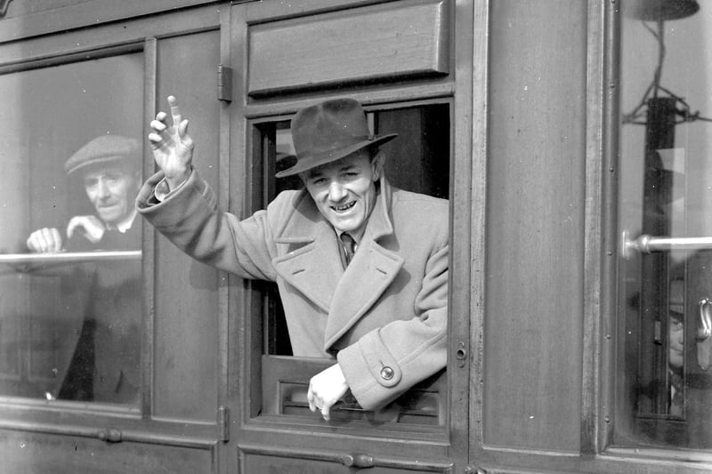 Boxer Teddy Gardner gives a wave to photographers as he leaves West Hartlepool railway station bound for Newcastle for a title fight in 1951.