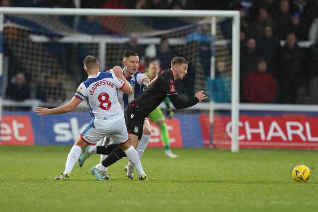 Hartlepool United's Nicky Featherstone and Euan Murray foul Stoke City's Liam Delap during the FA Cup Third Round tie. (Credit: Mark Fletcher | MI News)