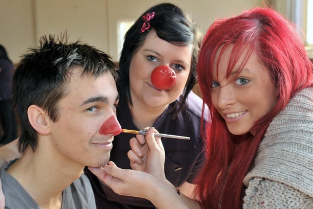 John Hartill has his nose painted red by fellow students Faye Maynard and Vicky Tyzack in 2011.