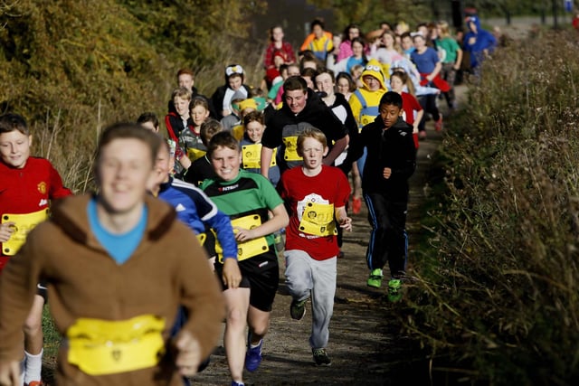 Students from English Martyrs School take part in the fancy dress fun run at Summerhill Country Park to help raise money for Children in Need.