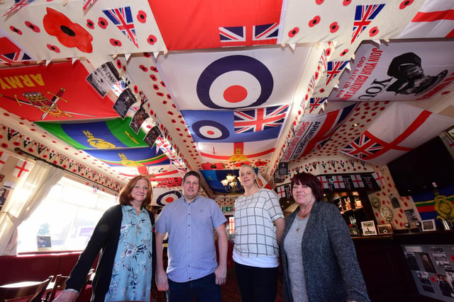 Landlord Russ Prentice, second left, and wife Lorna, third left, with Karen Archbold, far left, and Muriel Stewart, far right, after they decorated a room at the pub in honour of the Armed Forces.