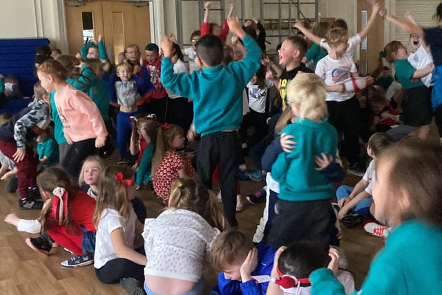 England fans at Clavering Primary School celebrate the sixth goal.