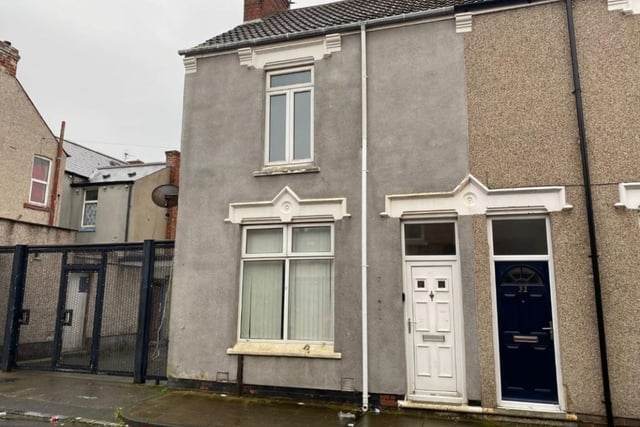 This terraced three bed house, in 34 St Oswalds Street (white door) is to be sold via auction in December.
