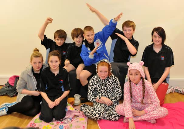 Dyke House pupils  take part in a 24-hour run to raise money for Children in Need in 2012.
