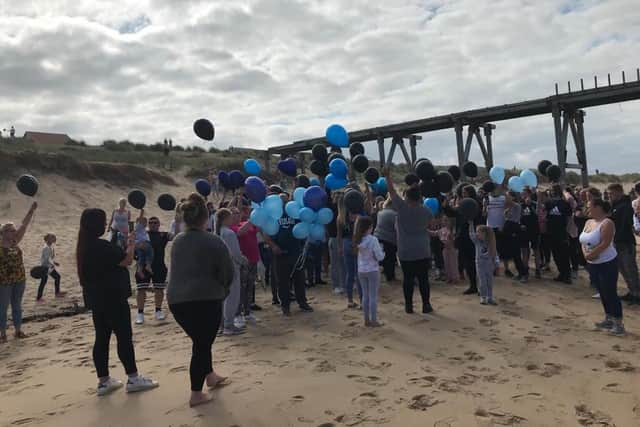 Hundreds gathered to take part in a balloon release for Matthew Sherrington.