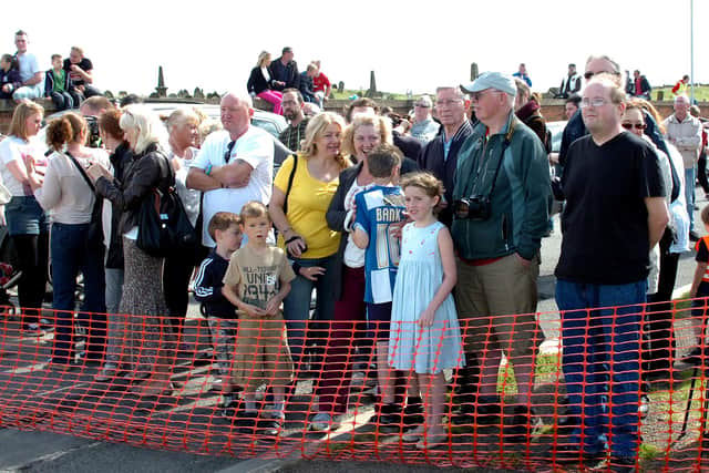 Crowds gathered to watch, film and photograph the demolition.