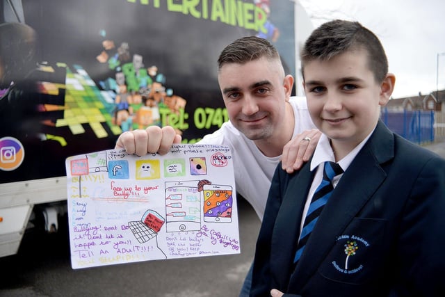 Eskdale Academy pupil Ellis Newbury won a poster design competition in 2018 and here he is with Michael Fawcett from Gamer Entertainer.