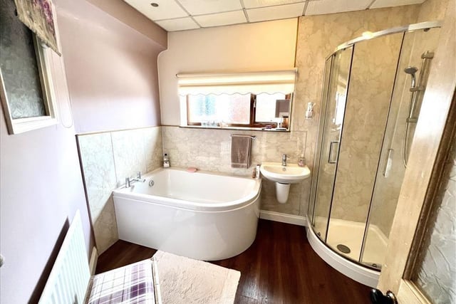 The family bathroom is fitted with a shower room and a huge bath.
