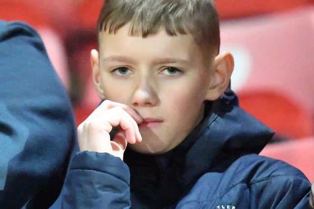 This young fan was nervous even before kick-off - and he was right to be.