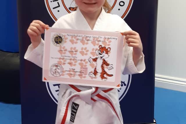 Katherine pictured enjoying one of her other loves of karate.