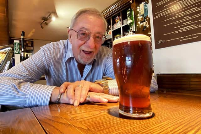 David Mountney, landlord of the Blacksmiths Arms with a pint of the pub's bicentennial beer./Photo: Frank Reid