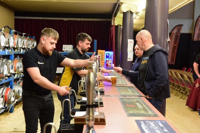 Hartlepool Round Table members behind the bar. Individual kegs were sponsored by local businesses.