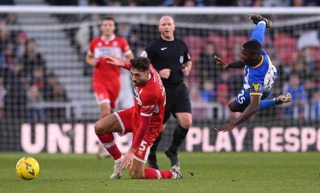 Brighton player Moises Caicedo is challenged by Matt Crooks of Boro. (Photo by Stu Forster/Getty Images).