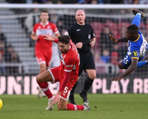 Brighton player Moises Caicedo is challenged by Matt Crooks of Boro. (Photo by Stu Forster/Getty Images).
