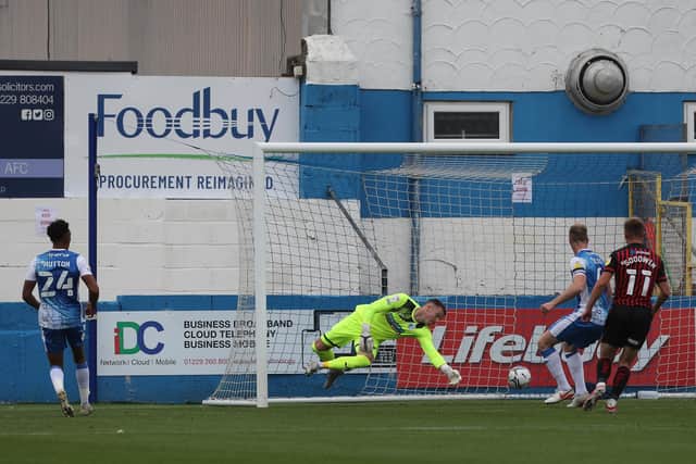 Barrow's Paul Farman is beaten by Tyler Burey's shot to level the score at 1-1 during the Sky Bet League 2 match between Barrow and Hartlepool United at Holker Street, Barrow-in-Furness on Saturday 14th August 2021. (Credit: Mark Fletcher | MI News)