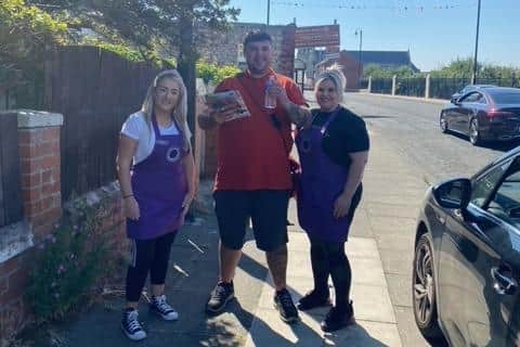 Emily (pictured left) and Jemma (pictured right) with a postman on duty, offering ice pops and cold water in Hartlepool.