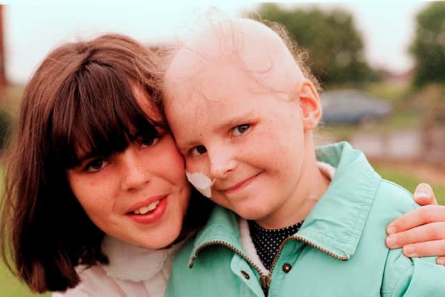 The late Elaine Swift, left, with younger sister Christine as children.