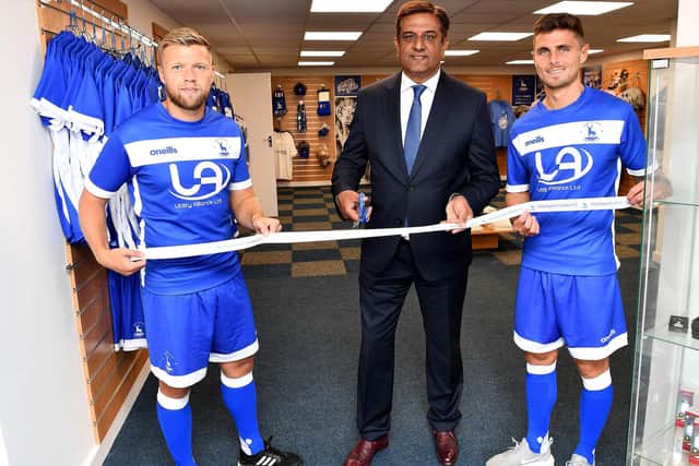 Hartlepool UnitedfChairman Raj Singh with players Nicky Featherstone (left) and Gavan Holohan (right) open the new club shop in 2019. Picture by Frank Reid