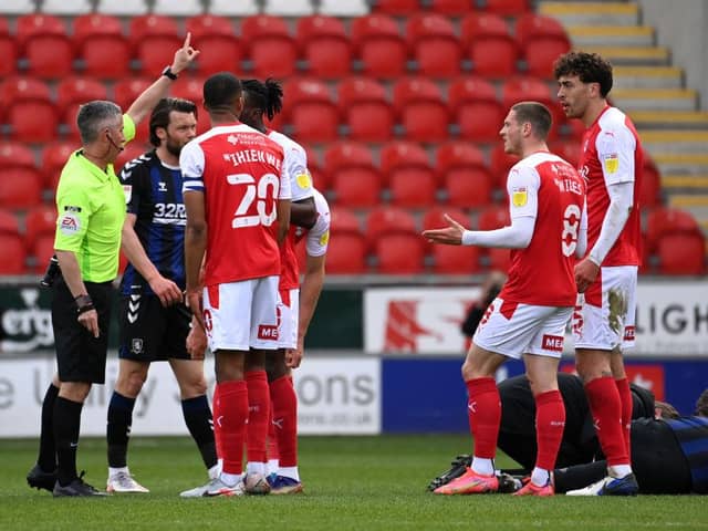 Match Referee Darren Bond instructs Matt Crooks of Rotherham United to leave the field after being sent off.